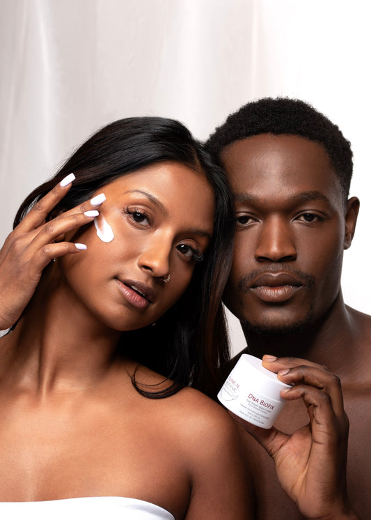 Asian man black man holding DNA BioFix cream by clinical botanic 